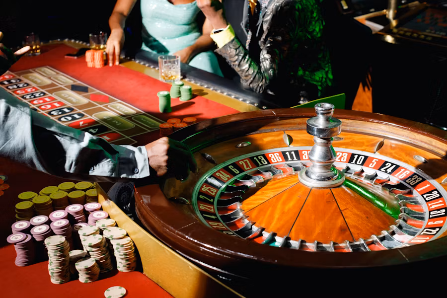 Professional casino tables including blackjack, poker, and roulette