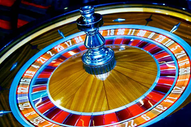 Professional roulette table with dealer and guests